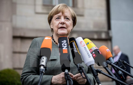 Thủ tướng Angela Merkel trả lời phỏng vấn trước cuộc đàm phán ở Berlin, ngày 16/11.