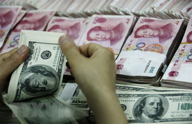 Đồng USD và đồng nhân dân tệ của Trung Quốc tại ngân hàng ở tỉnh An Huy.