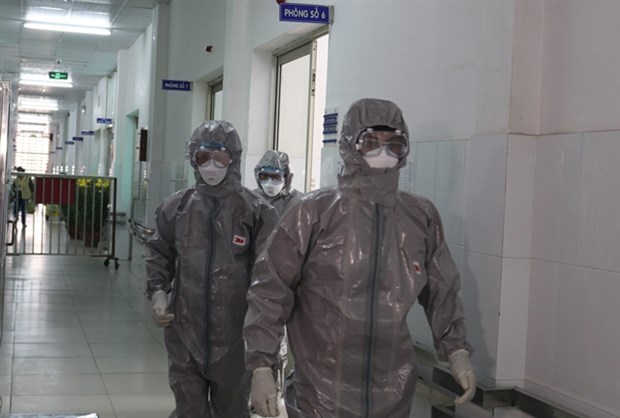Doctors of the Cho Ray Hospital wear protective clothing when entering the quarantine area.
