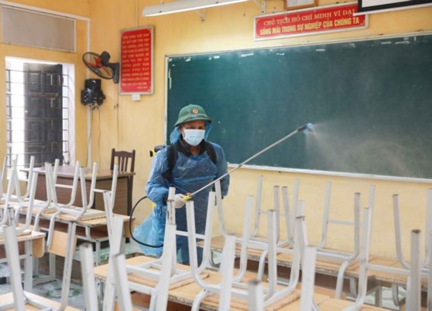 A classroom in Hanoi is sterilised.