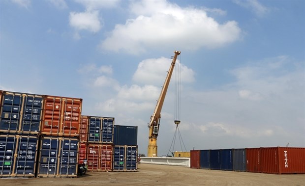 Cargo containers are loaded at My Thoi Port in the southern province of An Giang.