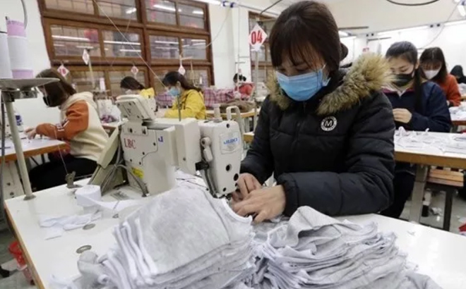 Workers produce garment products for export.