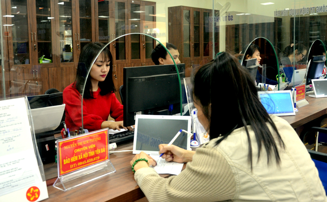 Staff handles public administrative procedures at Yen Bai’s centre for public administrative services.