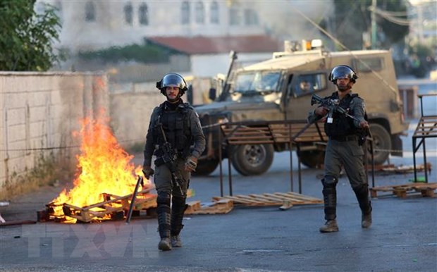 Cảnh sát biên giới Israel trong cuộc xung đột với người biểu tình Palestine tại làng Turmus Ayya, gần Ramallah, Khu Bờ Tây ngày 8/7/2021.