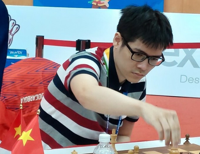 Lê Tuấn Minh tại chung kết cờ chớp cá nhân gặp Lê Quang Liêm, ở SEA Games 31 tại Quảng Ninh hôm 20/5.