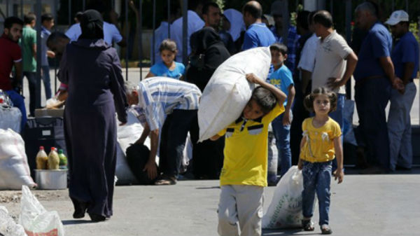 Người dân Syria di cư sang Thổ Nhĩ Kỳ. (Ảnh: Reuters)