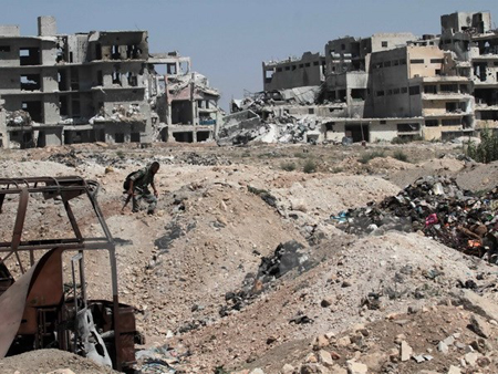 Nhà cửa bị phá hủy tại thành phố Aleppo, miền bắc Syria ngày 12/9.
