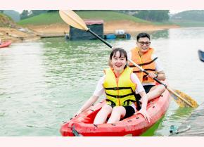 Visitors join activities at Thac Ba Lake tourist destination.