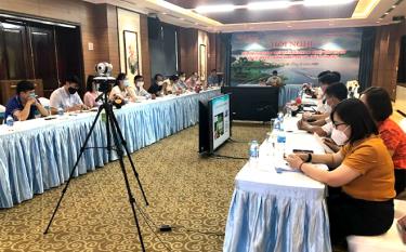 Participants attend the teleconference at Yen Bai province’s site.