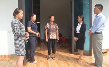 Ta Thi Ly, a resident in Tan Huong commune’s Yen Thang village, in her new house.
