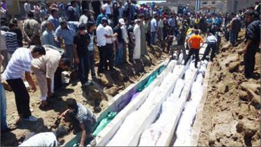 Các nạn nhân trong vụ thảm sát tại Houla, miền trung Syria (Ảnh: AP)
