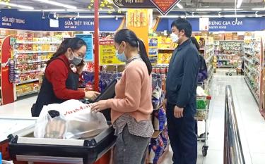 People shop at a supermarket in Yen Bai city.
