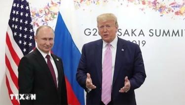 Ông Donald Trump, khi đương chức Tổng thống Mỹ và Tổng thống Nga Vladimir Putin tại cuộc gặp bên lề Hội nghị thượng đỉnh G20 ở Osaka, Nhật Bản, ngày 28/6/2019 (Ảnh: Reuters/TTXVN)