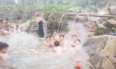 Visitors enjoy hot spring baths in Cao Son village, Phong Du Thuong commune, Van Yen district.