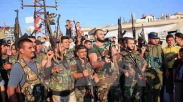 Binh sỹ quân đội Syria sau khi giành lại quyền kiểm soát ngôi làng Tayyibat, tỉnh Hama.