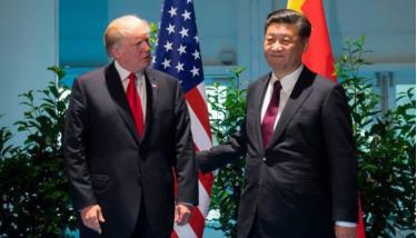 Tổng thống Mỹ Donald Trump (trái) và Chủ tịch Trung Quốc Tập Cận Bình trong cuộc gặp ở Hamburg, Đức, tháng 7/2017.