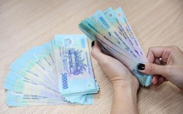 Bộ Nội vụ có Thông tư hướng dẫn thực hiện quản lý m88 m thể thao, tiền lương, thù lao, tiền thưởng trong doanh nghiệp nhà nước. Ảnh minh họa.