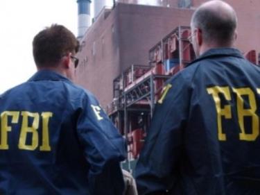 Ảnh minh họa nhân viên FBI trong một truy quét tội phạm.