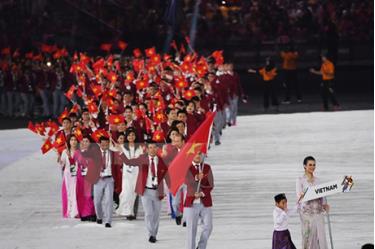 Đoàn thể thao Việt Nam diễu hành tại lễ khai mạc SEA Games ở Kuala Lumpur ngày 19/8.