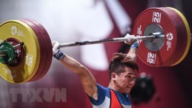 Lực sỹ Trịnh Văn Vinh thi đấu hạng 62kg nam môn cử tạ ASIAD 2018 ở Jakarta, Indonesia ngày 21/8 vừa qua.