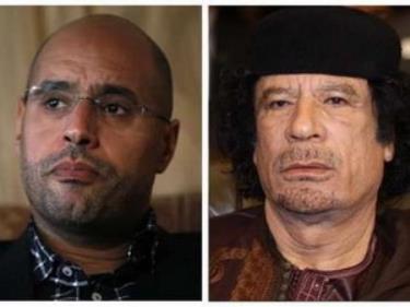 Ông Gaddafi và con trai Saif (Nguồn: Reuters).