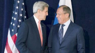 Ngoại trưởng Mỹ Kerry (trái) thảo luận về cuộc khủng hoảng Syria với người đồng cấp Nga Lavrov ngày 27-9.