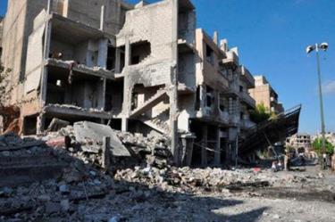 Hiện trường vụ đánh bom xe tại chốt kiểm soát ở khu vực Bab Tadmur thuộc tỉnh Homs, miền Trung Syria.