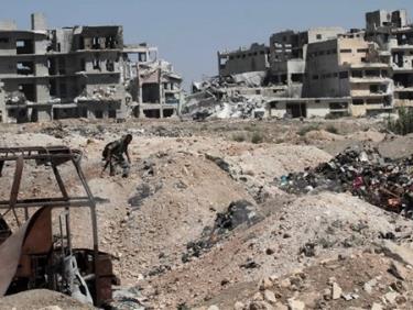 Nhà cửa bị phá hủy tại thành phố Aleppo, miền bắc Syria ngày 12/9.