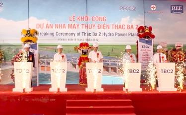 Representatives of the authorities, contractors and construction unit press a symbolic button to kick off the building of the project.